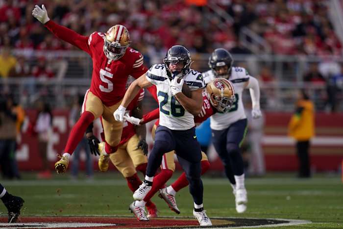 Randy Gregory runs behind Zach Charbonnet